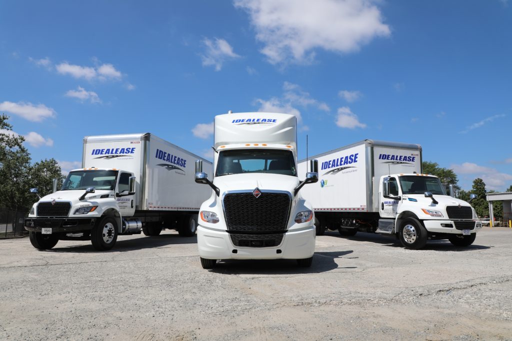 Idealease rental trucks including an International MV Series 5 Ton Van Body, electric International eMV Series and International LT Series Highway Tractor.